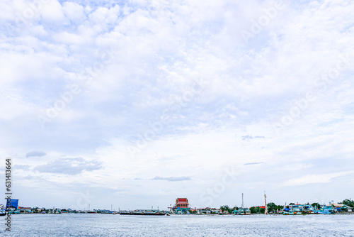 View Point Bridge, Wat Chong Lom, Tha Chalom, Samut Sakhon, Thailand, see the view of the sky, the blue sea, temples and residential villages in the evening. photo