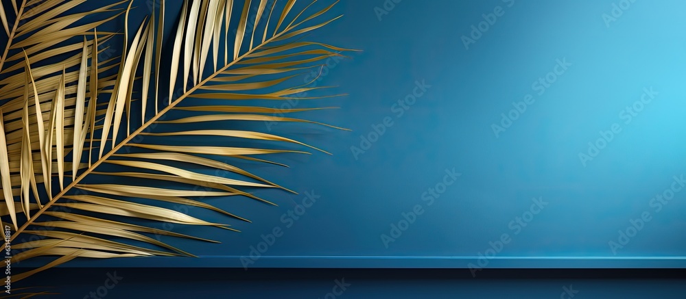 Fototapeta premium The Blue Abstract Background features a Golden Palm Leaf Pattern Texture with plenty of space for