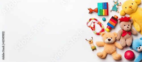 collection of baby and kids toys displayed on a white background. The view is from the top  and