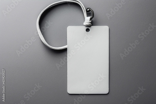 Empty layout layout on grey background, Common blank label name tag hanging on neck with thread