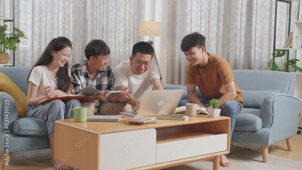 Asian Teen Group Studying At Home. Break Time, Watching Funny Video, Laughing At Joke, Using Laptop, Working On Online Project 
