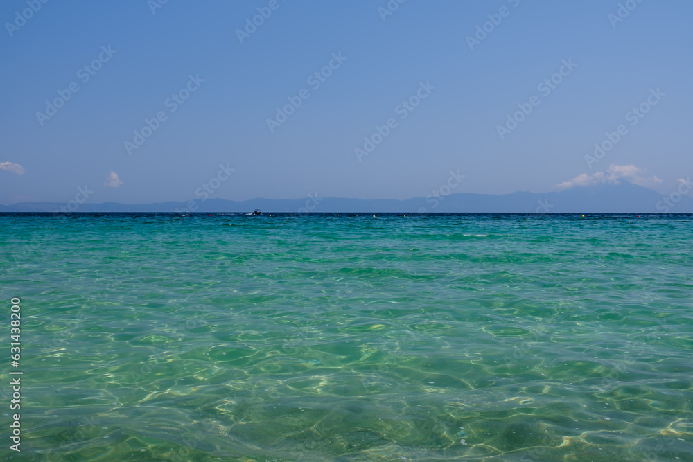View of the beautiful sandy and crystal clear turquoise  beach of Armenistis Camping in Chalkidiki  Greece