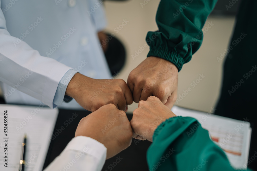 Doctors shaking hands, working together as a team at the hospital. Doctors shaking hands, working together as a team at the hospital.