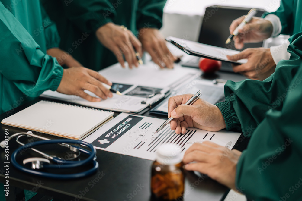 Medical team working on digital tablet healthcare doctor technology tablet using computer analyzed the results of medical reports, an online conference at the hospital.