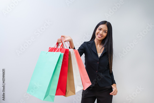 Happy beautiful woman showing shopping bags with goods, buying with discounts.