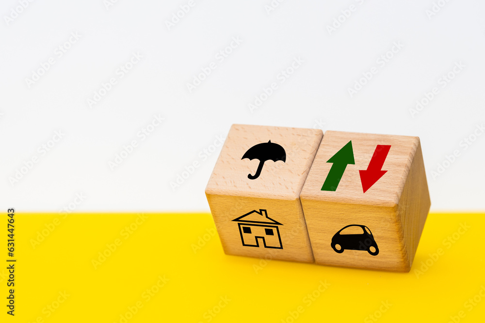 Variable insurance costs, increasing and decreasing, concept, wooden cubes with up and down arrow symbols, market analysis. Individual protection, Securing assets, real estate, individual valuation Variable insurance costs, increasing and decreasing, concept, wooden cubes with up and down arrow symbols, market analysis. Individual protection, Securing assets, real estate, individual valuation