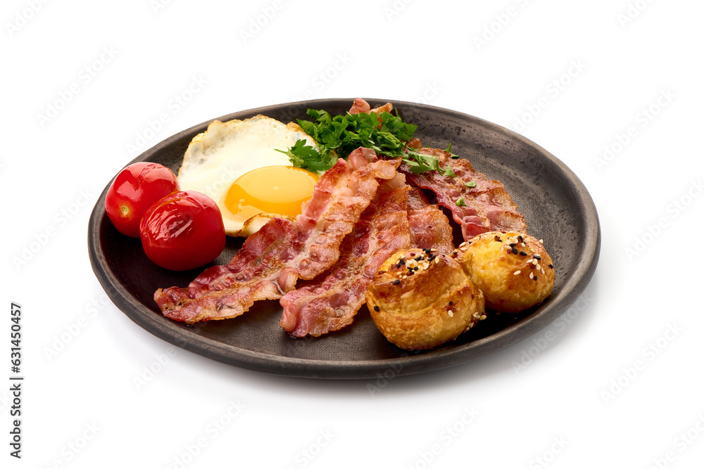 Cooked bacon rashers with egg, close-up, isolated on white background. Cooked bacon rashers with egg, close-up, isolated on white background.
