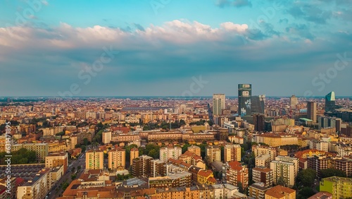 Aerial view of the skyline of a modern cityscape of business skyscrapers. Palazzo Lombardy Region, unicredit tower and UnipolSai, vertical forest. Biblioteca degli Alberi Drone. Milan Italy. © Andrew