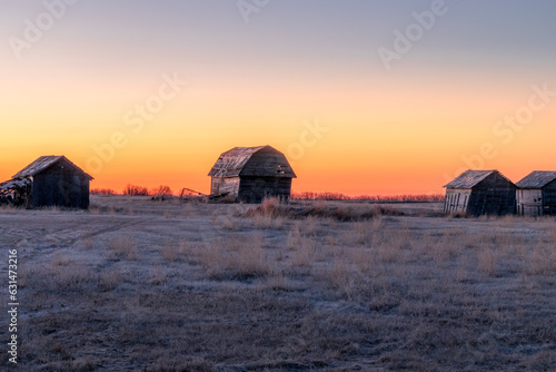 Sunrise over rustic farm buildings Keoma Alberta Canada