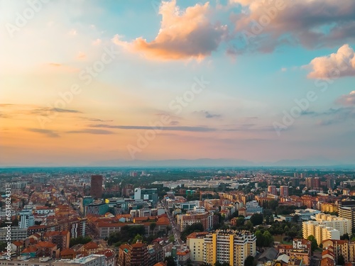 Skyline of a big city with beautiful clouds at sunset. Business and finance concept. Milan, Italy