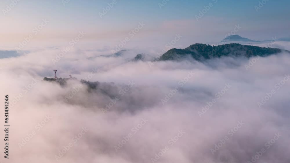 4K motion time lapse video aerial view morning scenery Mist flowing over the high mountains The movement of fog and clouds, Pang Puey, Mae Moh, Lampang, Thailand 4K motion time lapse video aerial view morning scenery Mist flowing over the high mountains The movement of fog and clouds, Pang Puey, Mae Moh, Lampang, Thailand