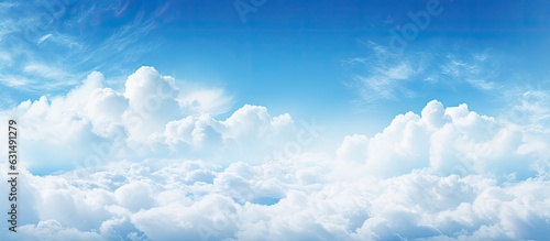 Background with blue sky, clouds, and space for text.