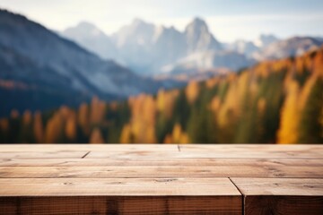 Wooden table top on blurred background of autumn color landscape in dolomites - for display your products
