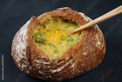 Homemade Broccoli and Cheddar Soup in a Bread Bowl. Czech cuisine