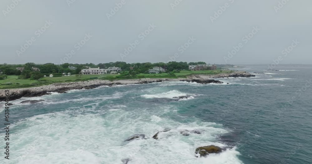 Drone flying by rough coastline with mansions in newport us east coast Drone flying by rough coastline with mansions in newport us east coast