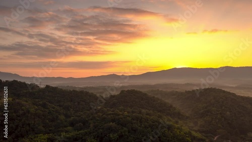 Wallpaper Mural Hyperlapse Video (4K), Beautiful aerial view of a mountain with the sun shining golden, Baan Pang Puai, Mae Moh, Lampang, Thailand.	 Torontodigital.ca