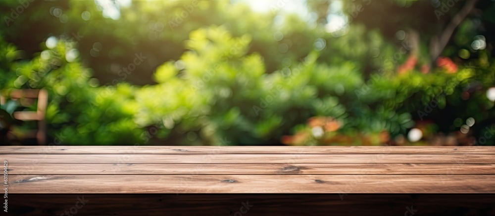 A wooden table with no objects on it and a blurred background of an outdoor garden. It provides A wooden table with no objects on it and a blurred background of an outdoor garden. It provides