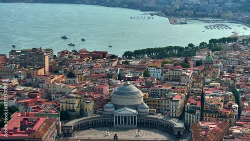 A view of Napoli, Italy, Aerial view of the historic center, panoramic drone view of the entire city of Italy. Flight over historical landmarks, narrow streets and buildings with colour rooftops photo