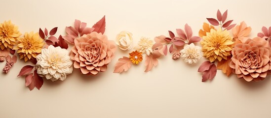 Autumn Floral Composition with a border created using fresh flowers on a pastel beige background.