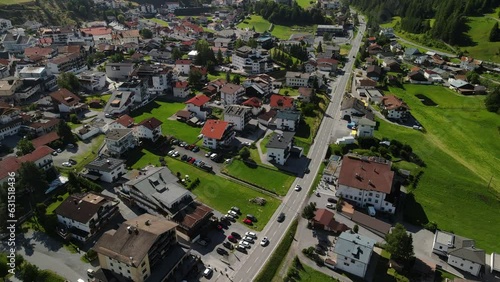 South Tirol village embedded in green mountain landscape from top photo