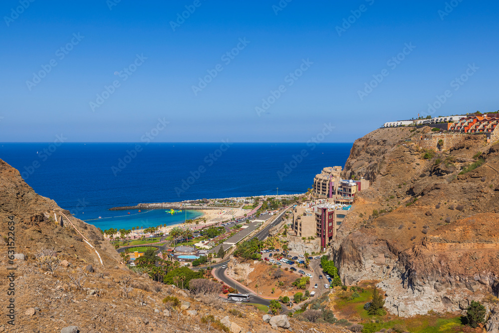 Beautiful view of mountainous coast of Gran Canaria overlooking city and sandy beach. Spain. 