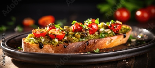 Bruschetta with olive oil, olives, pesto, garlic, and Parmesan is a delicacy that is both delicious