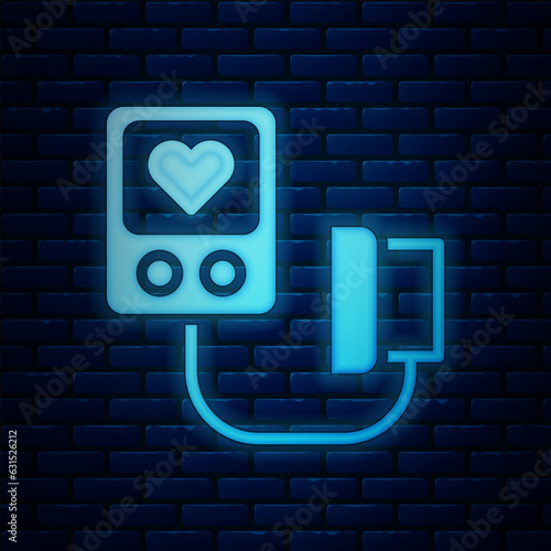 Glowing neon Blood pressure icon isolated on brick wall background. Vector