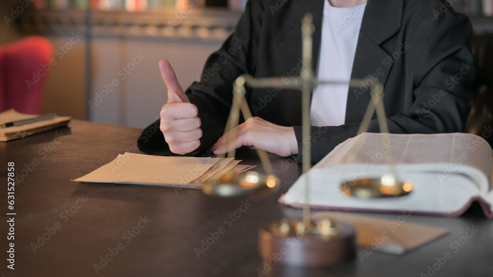Close Up of Thumbs Up by Female Judge in Court