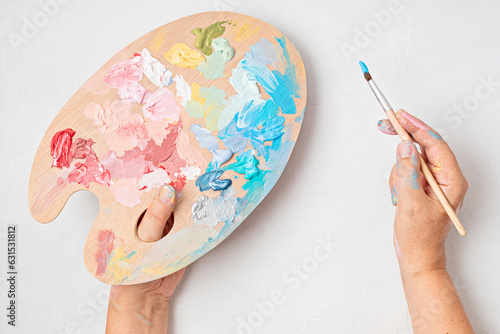 Artist painting palette with brushes. Craft hobby background. Recomforting, destressing hobby, art therapy photo