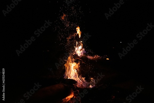 Orange and yellow glowing fire burning in a contained area © Pentatech/Wirestock Creators