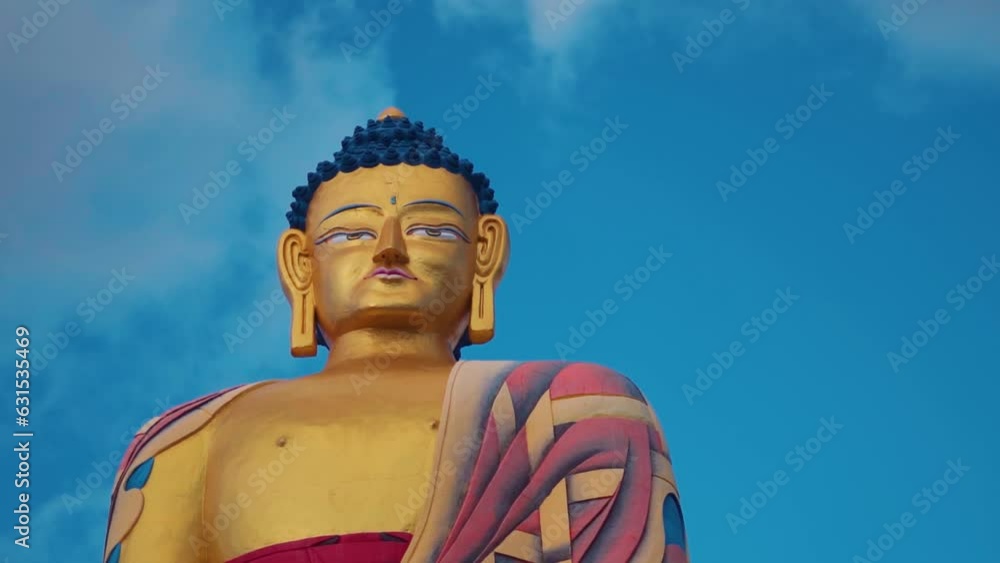 Closeup shot of Langza buddha statue against blue sky with clouds at Langza village in Spiti Valley, Himachal Pradesh, India. Buddha statue in a village in Spiti valley at high altitude. Closeup shot of Langza buddha statue against blue sky with clouds at Langza village in Spiti Valley, Himachal Pradesh, India. Buddha statue in a village in Spiti valley at high altitude.