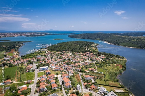 Aerial view of the stunning Croatian coastal town of Pomer with its picturesque oceanfront buildings photo