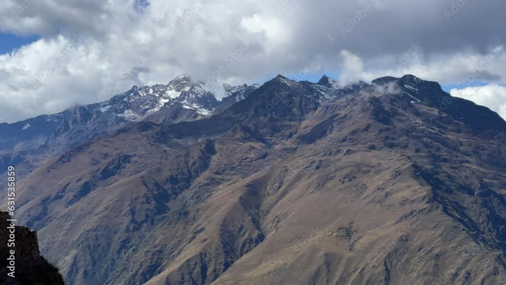 Ancient Cachicata building on top of a mountain in Peru with a landscape in the background Ancient Cachicata building on top of a mountain in Peru with a landscape in the background
