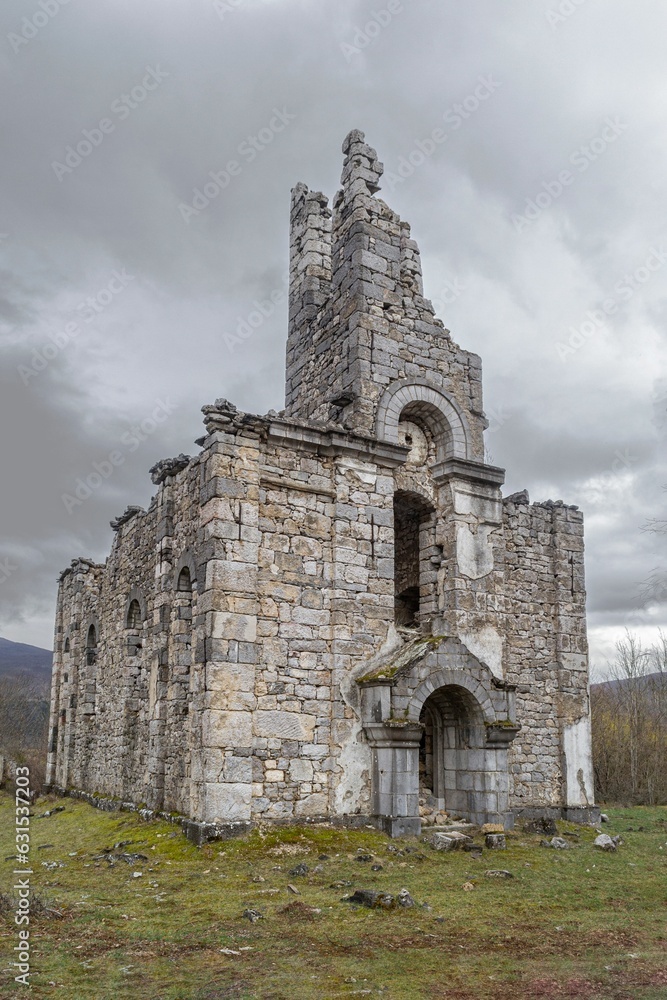 Vertical shot of old Orthodox church ruins on a gloomy day in Croatia Vertical shot of old Orthodox church ruins on a gloomy day in Croatia