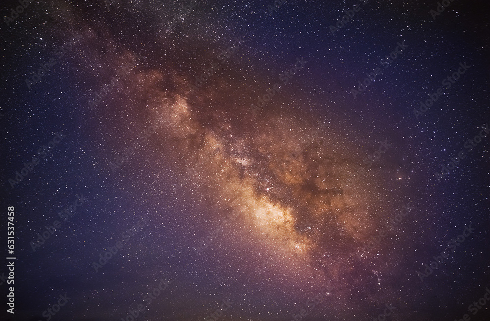 The Milky Way galaxy on a starry night sky with the core of the galaxy.
