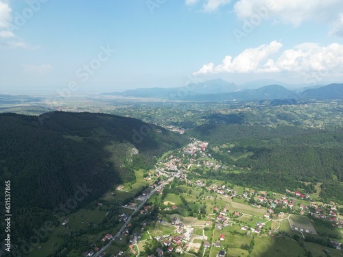 Idyllic rural landscape with the village of Moieciu de Jos  Romania  summertime