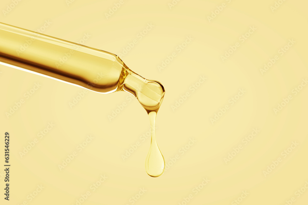 Cosmetic pipette with a falling drop of gold color on a yellow yellow background. Cosmetic pipette with a falling drop of gold color on a yellow yellow background.