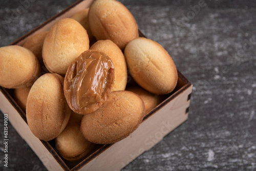 photo box with nuts with boiled condensed milk , homemade, fresh, sweet dessert