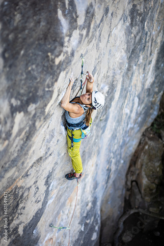 Women climbing in mountains, courage safety and determination