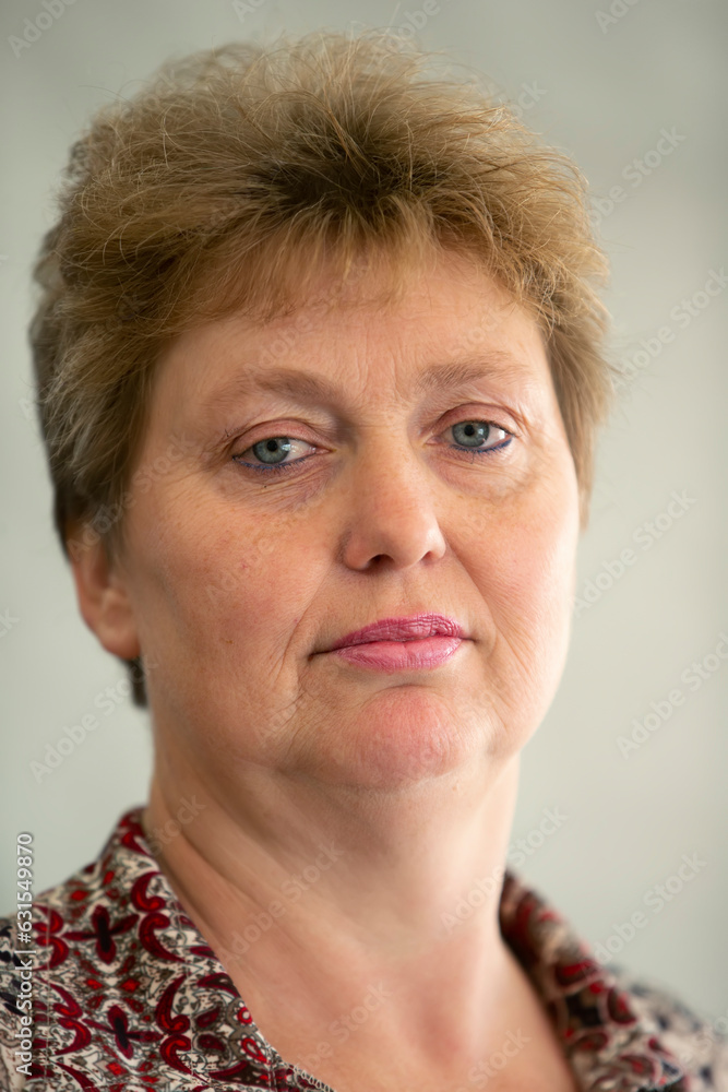 Photographing ordinary elderly people. Close-up portrait of an elderly woman with wrinkles and a short haircut. Photographing ordinary elderly people. Close-up portrait of an elderly woman with wrinkles and a short haircut.