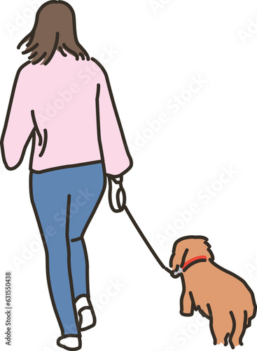 屋外で犬と散歩する若い女性
