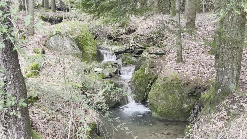 Beautiful small cascading waterfall in Tuscan mountains Beautiful small cascading waterfall in Tuscan mountains
