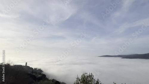 Sea of clouds is a fairly frequent atmospheric phenomenon in the Valdichiana, Cortona, Tuscany photo