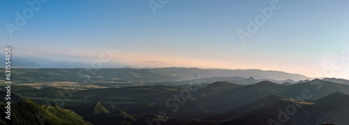 Fototapeta Naklejka Na Ścianę i Meble -  Panoramic view of mountains covered in greenery in the countryside