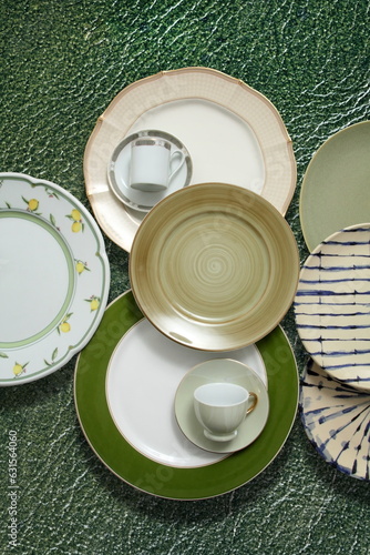 plates, cups and bowls in creative montage seen from above