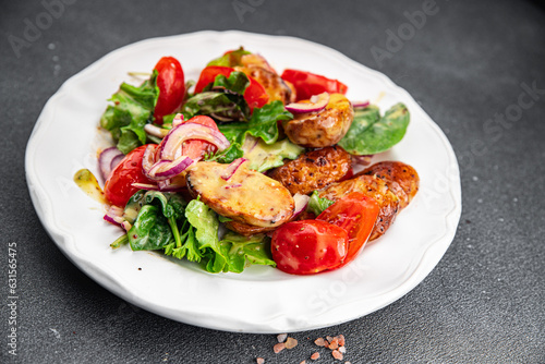 baked potato salad vegetable potato, tomato, onion, salad leaves, salad dressing vinaigrette vegetables food healthy meal food snack on the table copy space food background rustic top view 