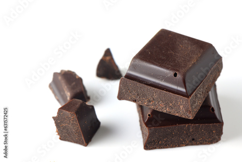 a piece of dark chocolate on a white background, studio shooting