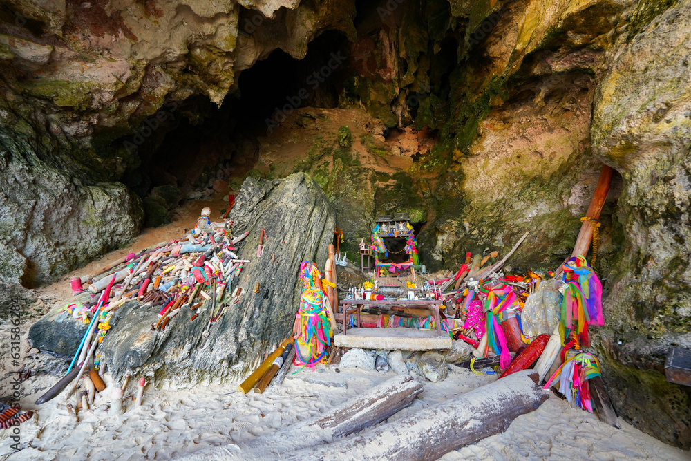 Wooden sculptures of phalluses of different colors in the Princess Cave, a buddhist temple on Phra Nang Cave Beach on the Railay Peninsula in the Province of Krabi, Thailand