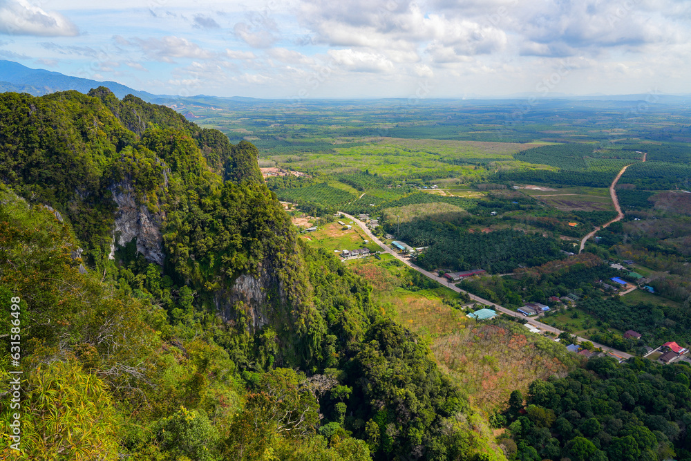 Plain with palm tree plantations seen from the hilltop pagoda of the Wat Tham Suea, the Tiger Cave Temple of Krabi in the south of Thailand