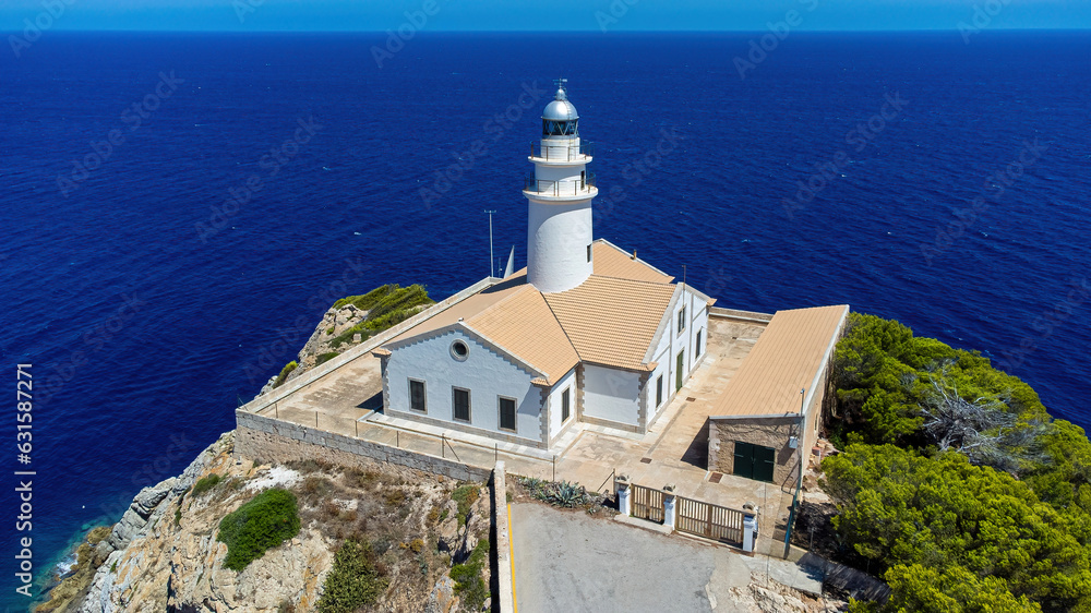 Capdepera lighthouse on the easternmost point of Majorca in the Balearic Islands, Spain - Rocky cape with a navigational beacon in the Mediterranean Sea